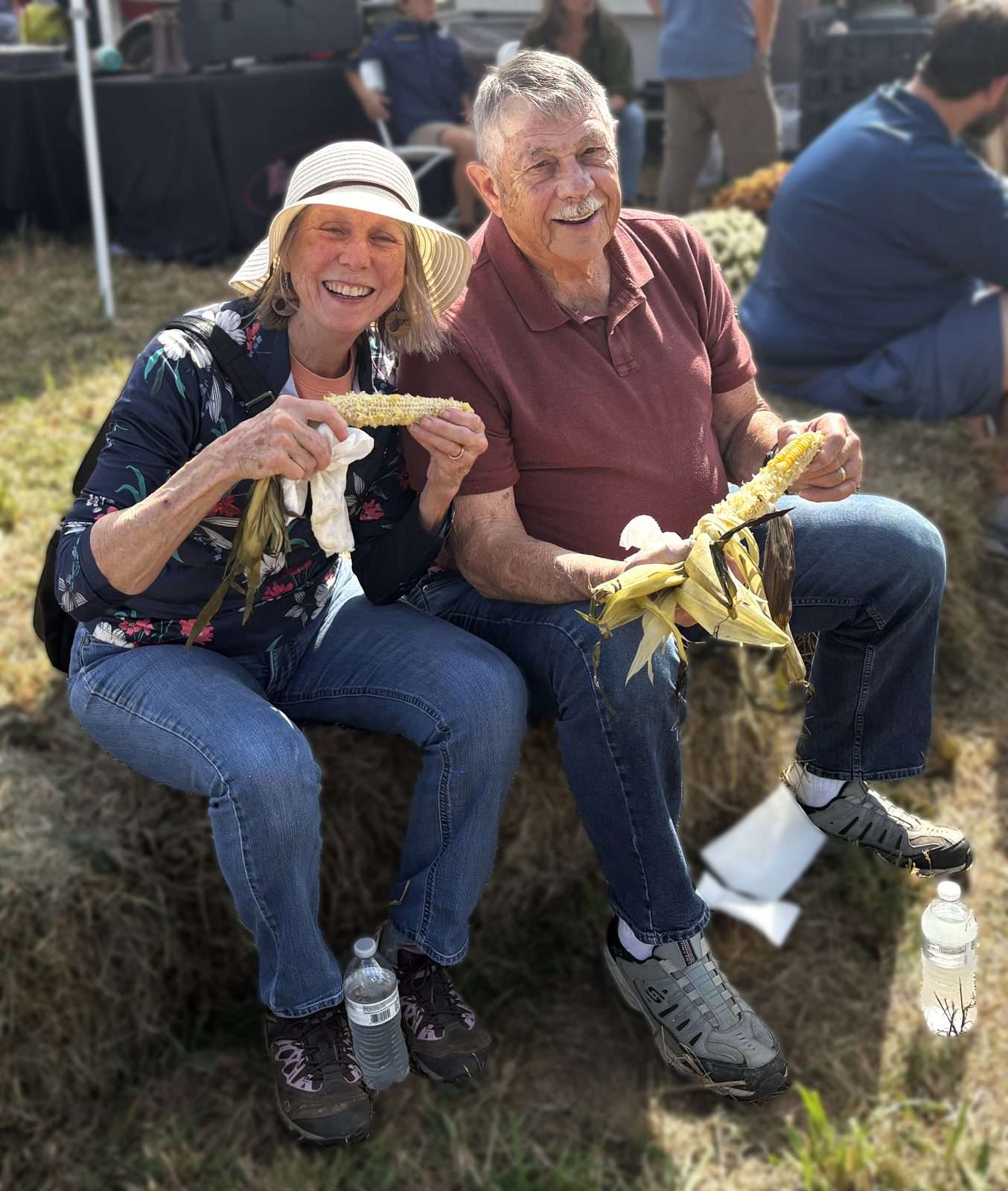 Couple enjoying roasted corn at the Valle Country Fair