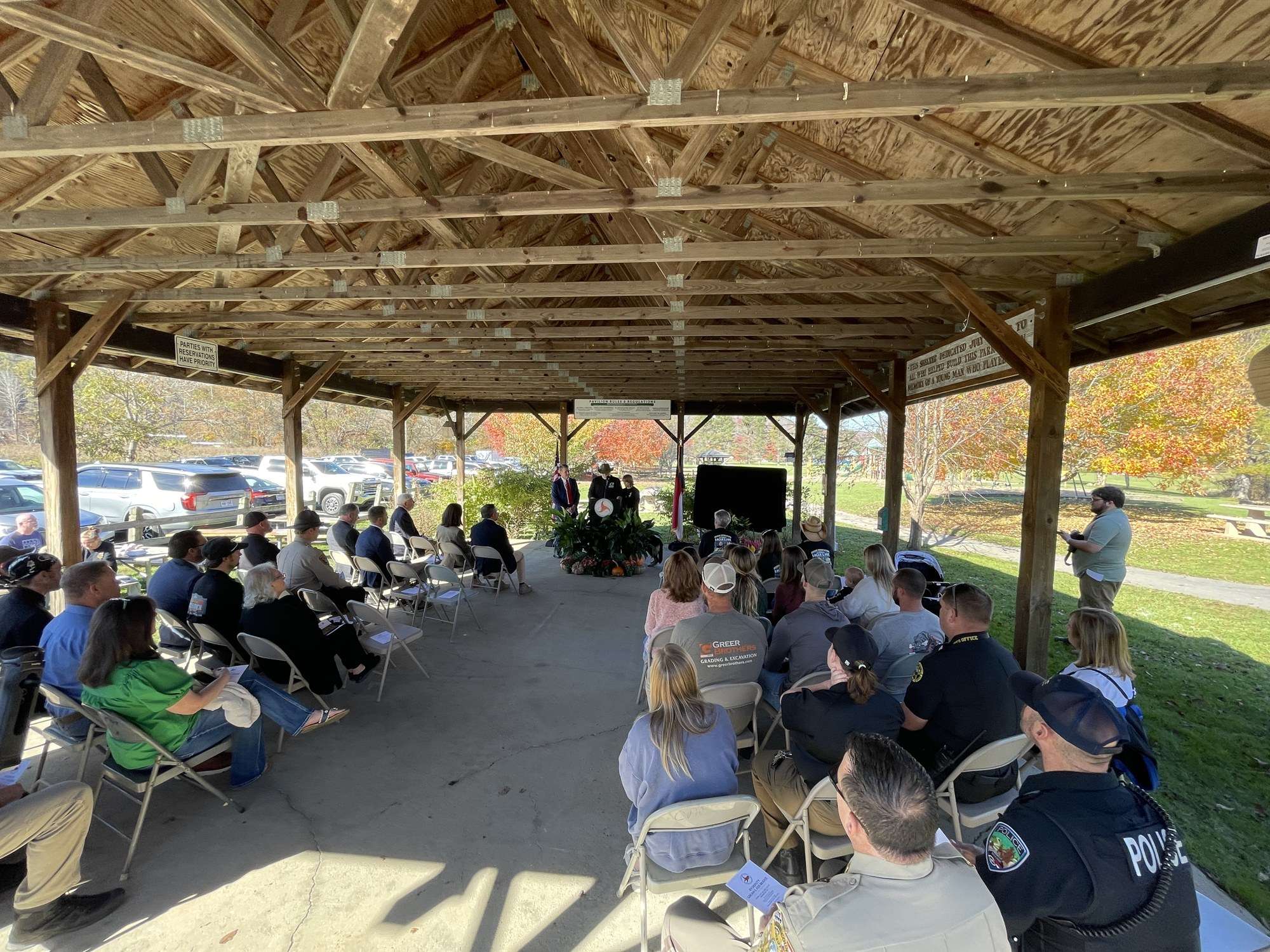 Crowd seated under the pavilion