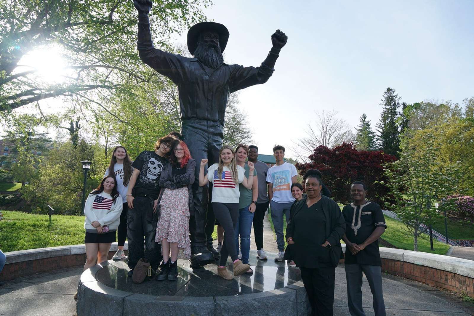 GEAR UP students and families pose in front of the Yosef statue on App State’s Boone campus