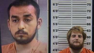 Booking photos of two men in orange jail clothing