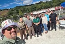 Law enforcement officers and volunteers on the Bojangles roof during the sixth annual Rooftop Cops event in Jefferson.