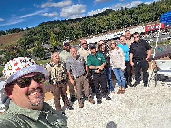 Law enforcement officers and volunteers on the Bojangles roof during the sixth annual Rooftop Cops event in Jefferson.