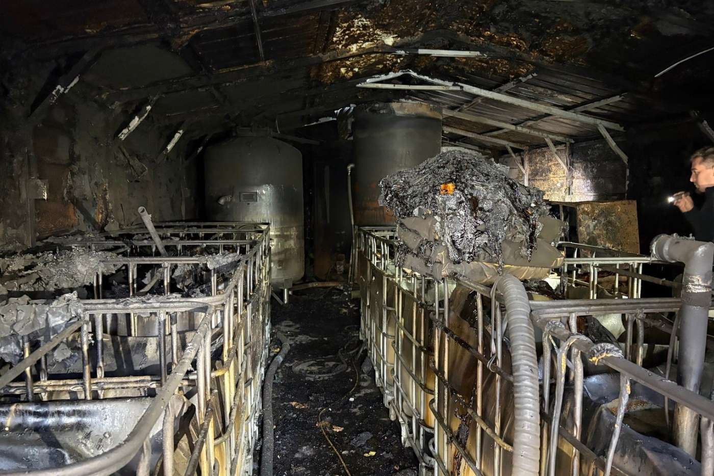Burned barn with charred moonshine stills in Wilkes County